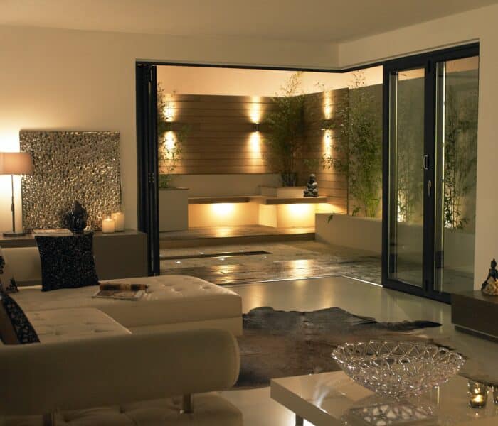 black origin ob72 bifold doors at night with a terrace view