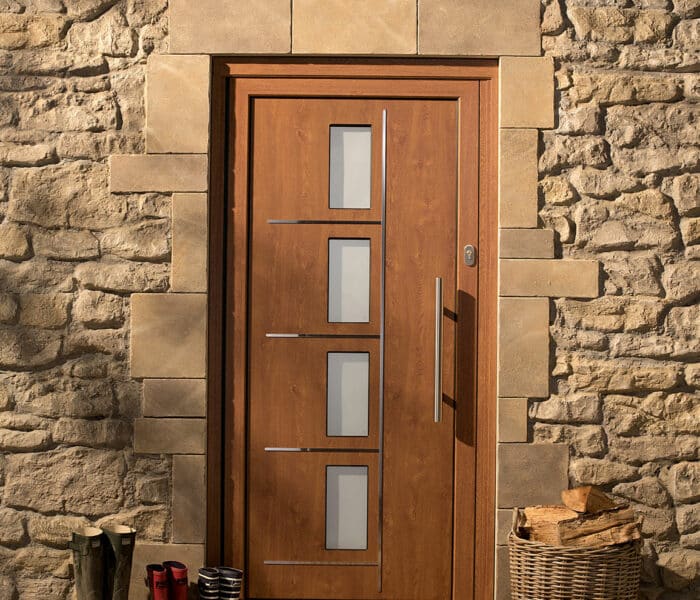 origin front doors in a stone house in oak colour