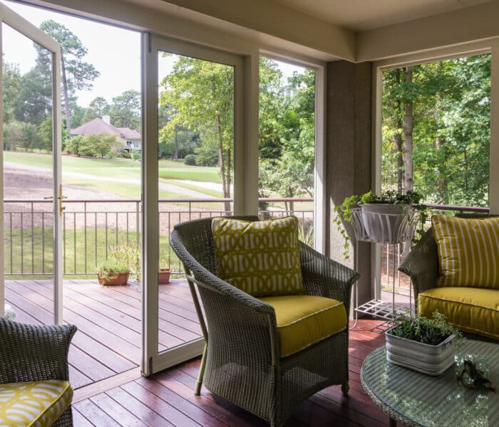 One Collection PVCu doors in a lounge setting with garden and terrace views