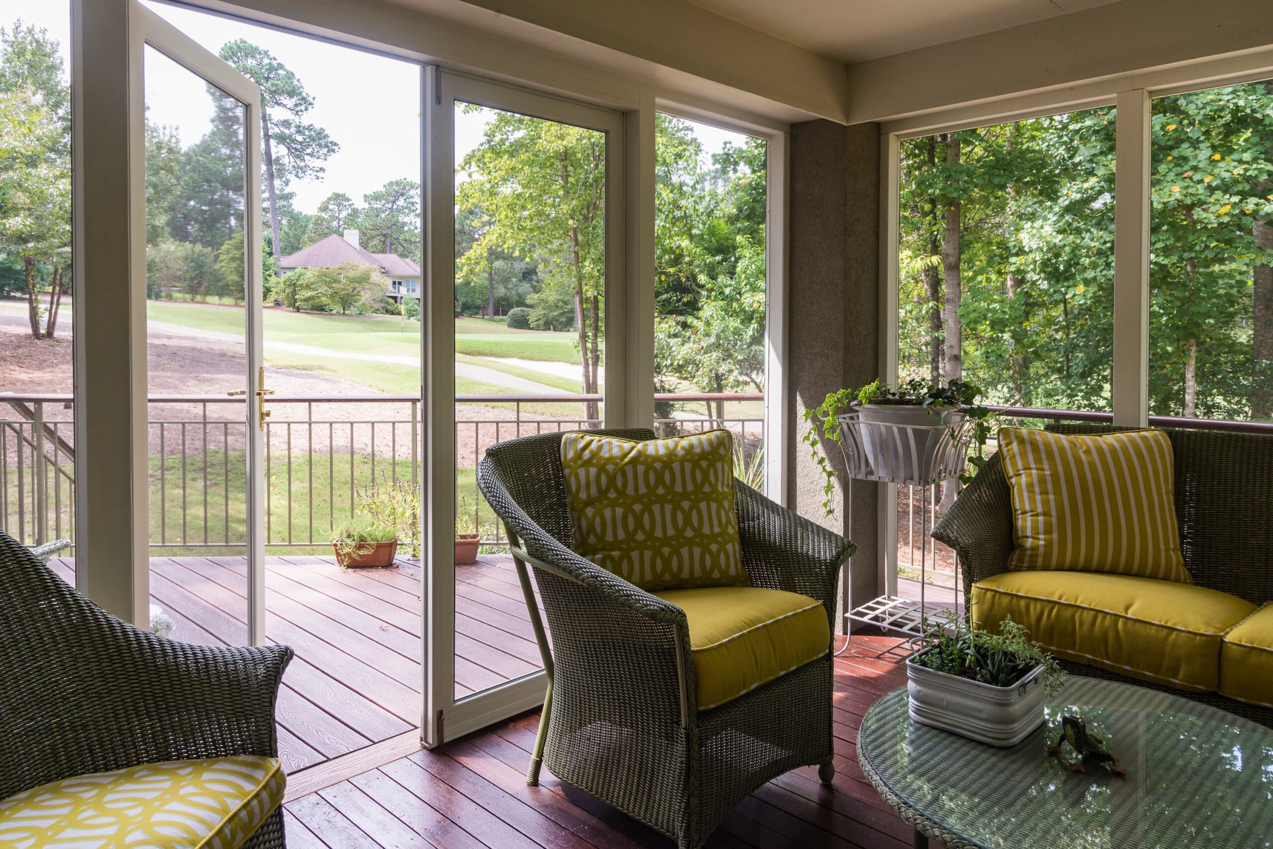 One Collection PVCu doors in a lounge setting with garden and terrace views