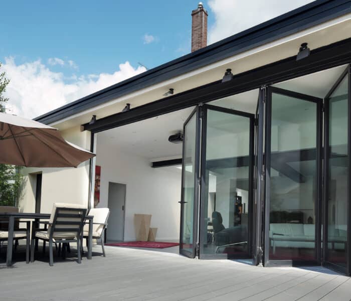 reynaers cf68 bifold door in a new extension partially open