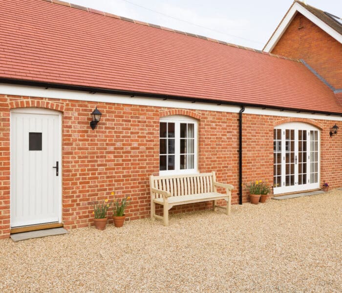 white timber windows and doors in a barn conversion