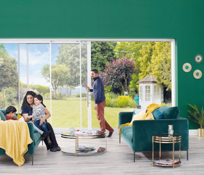 Origin OS-29 sliding door in green wall with family playing